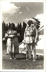 Indian Woman and Chief outside of Tepee Postcard