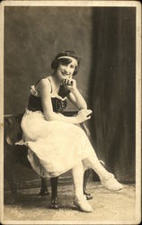 Young Woman Sitting while Dressed in Risque Clothing Risque & Nude Postcard Postcard Postcard