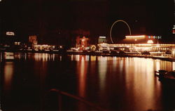 Night scene of the Amusement Section at Asbury Park, N.J., with Wesley Lake in the foreground. Postcard