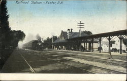 Train coming into Railroad Station Postcard