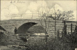 Man Standing Beside a Stone Bridge Postcard