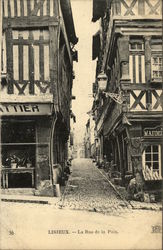 La Rue de la Paix Lisieux, France Postcard Postcard