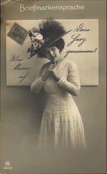 Woman in Hat Posing With Large Envelope Postcard