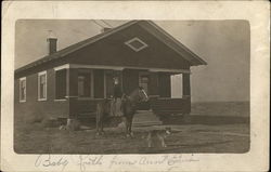 Woman on a Horse in Front of a House Postcard