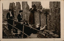 Kissing the Blarney Stone - Blarney Castle Ireland Postcard Postcard Postcard