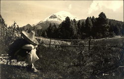 Man Sitting in a Country Field in front of a Mountain Mexico Postcard Postcard Postcard