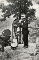 Couple Drinking From Bucket Postcard