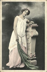 Girl in White Posing With Plant Stand Postcard