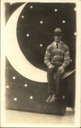 Portrait of Man Sitting on Paper Moon Moons Postcard Postcard Postcard