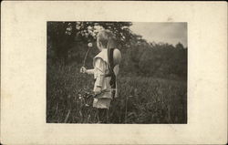 Boy in Field Holding Dandelion Postcard