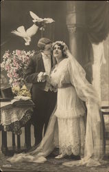 Two Doves Flying Over a Groom Kissing Bride Postcard