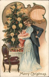 A Couple and Their Baby in Front of the Christmas Tree Postcard Postcard