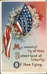 A Picture of the American Flag with White Flowers Patriotic Postcard Postcard