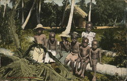 Children Sitting on Fallen Palm Tree Postcard