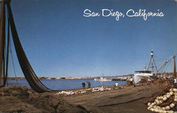 Striking View of the Embarcadero Showing Fisherman Repairing Their Nets Postcard