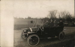 Four Men in Automobile Postcard