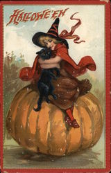 Child in Witch Costume Sitting on Pumpkin Holding Black Cat Halloween Postcard Postcard Postcard