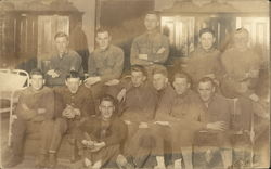 Snapshot of Men Sitting on Bunk Postcard