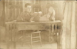 Soldier Reading at Table Postcard