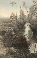 Girl Carrying Baby by River Postcard