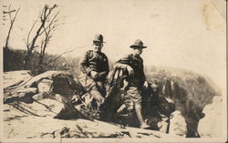 Two soldiers leaning against a rock Postcard