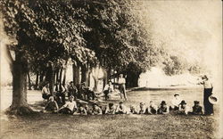 Snapshot of Men in Park Postcard