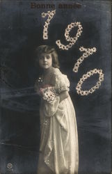 Bonne Annee (Happy New Year) 1910 Photo of young girl with flowers. Postcard