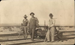 Three men building track for the railroad Circa 1900 Postcard