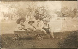 Three Children in Wagon Postcard Postcard Postcard