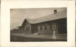 Woman Outside Train Station Postcard