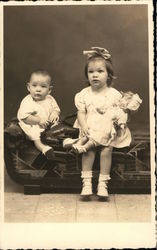 Portrait of Two Children - Girl with Doll Postcard