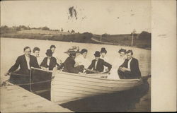 A group of people in three Row boats Circa 1909 Postcard