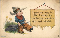 I have an aim in life: I want to make my mark in this old world. Little cowboy with rifle on rock Cowboy Kids Postcard Postcard Postcard