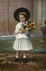 Girl in a hat holding flowers Postcard