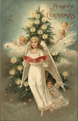 A Merry Christmas - Angels in front of a a tree Postcard Postcard Postcard