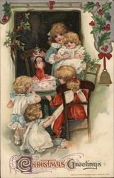 Christmas Greetings - children with a Christmas cake Postcard