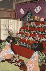 Two Asian Women Kneeling on Floor in Front of Large Doll Display Postcard