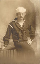 A Sailor Leaning Against the Back of a Chair Navy Postcard Postcard Postcard