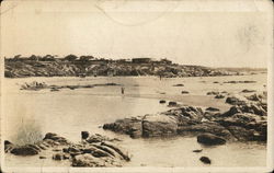 Homes Overlooking Rocky Beach Area Postcard