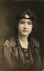 Woman with headband, beads Postcard