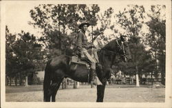 Soldier in Camp Posing on a Horse Postcard