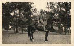 Soldier in Camp Posing on a Horse Postcard