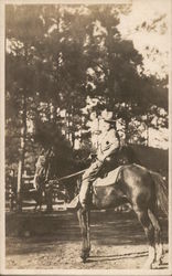 Soldier Posing on a Horse Postcard