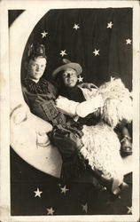 Two Men in Costume on Paper Moon, Black Postcard