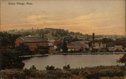 View of bridk buildings across a lake Postcard