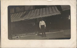 A man in front of a store Men Postcard Postcard Postcard