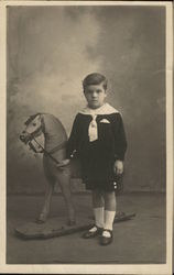 Portrait of Boy With Toy Horse Postcard