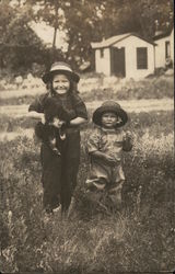 Two Children and Puppy in Field Postcard Postcard Postcard