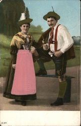 Man and Woman Dressed in Decorative Clothing Postcard