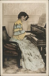 A Woman Sitting at a Piano Women Postcard Postcard Postcard